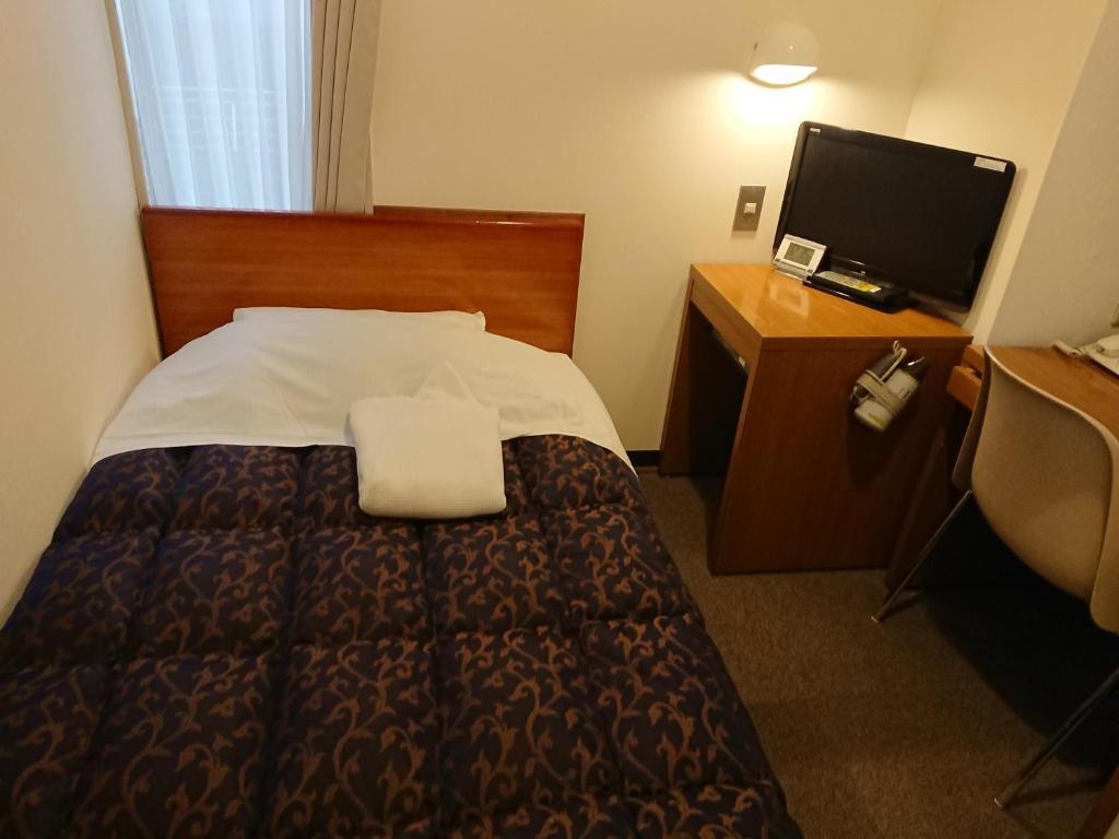Postel nebo postele na pokoji v ubytování Residence Hotel Will Shinjuku