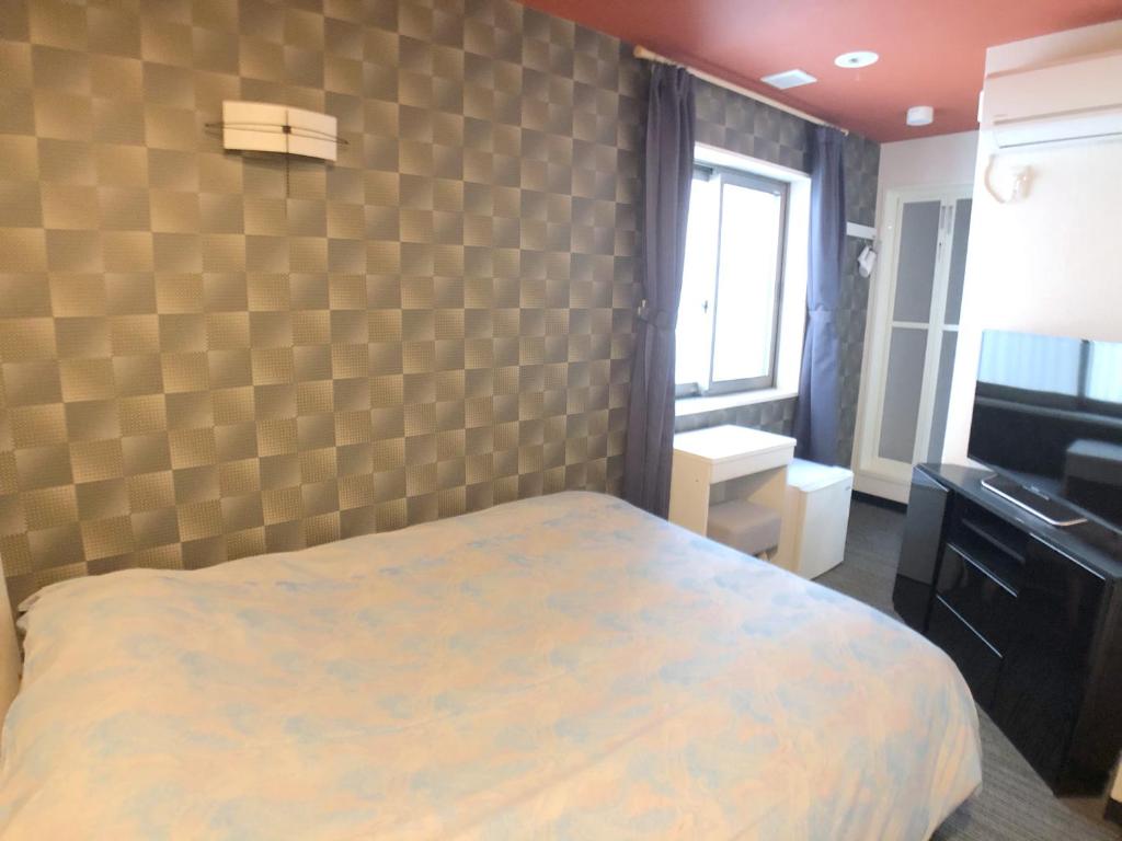 Postel nebo postele na pokoji v ubytování Tokyo Tourist Inn