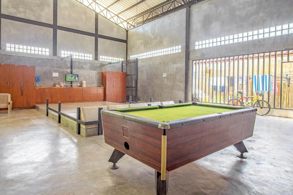 a large room with a pool table in it at OYO 585 Freedom Hostel @ Phi Phi in Phi Phi Islands