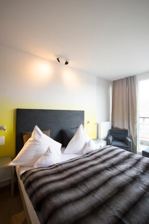 Postel nebo postele na pokoji v ubytování Das 54 Grad Nord - Apartments & More