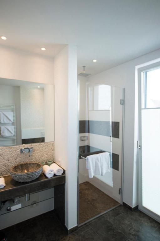 Postel nebo postele na pokoji v ubytování Das 54 Grad Nord - Apartments & More