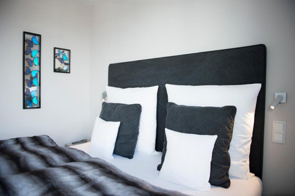 Postel nebo postele na pokoji v ubytování Das 54 Grad Nord - Apartments & More