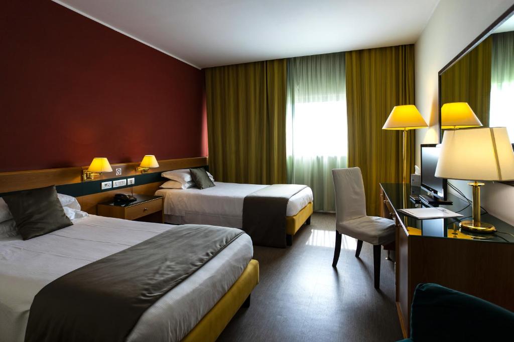 Postel nebo postele na pokoji v ubytování BV Hotel Oly