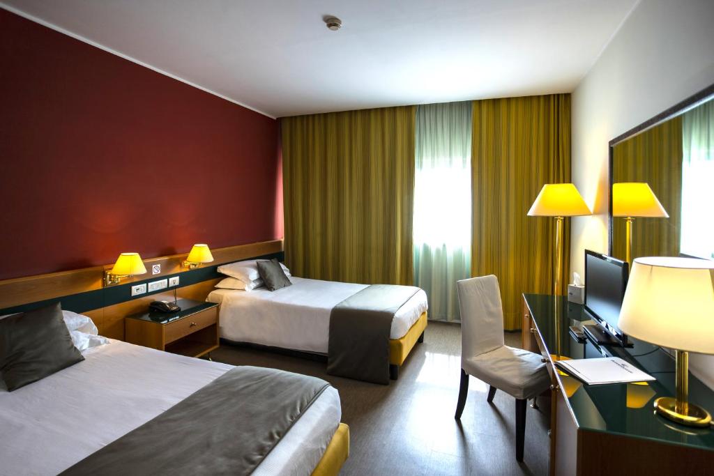 Postel nebo postele na pokoji v ubytování BV Hotel Oly