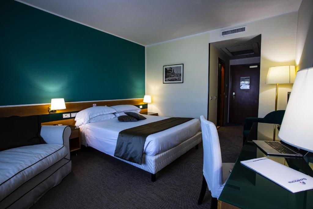 Postel nebo postele na pokoji v ubytování BV Hotel Oly