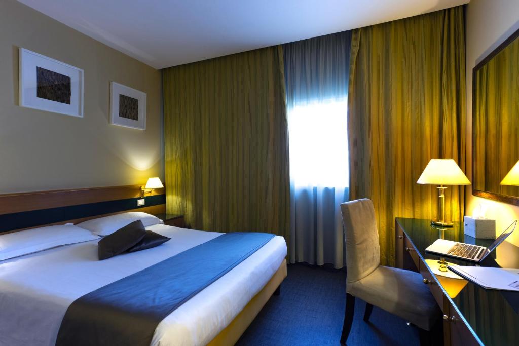 Postel nebo postele na pokoji v ubytování BV Hotel Oly