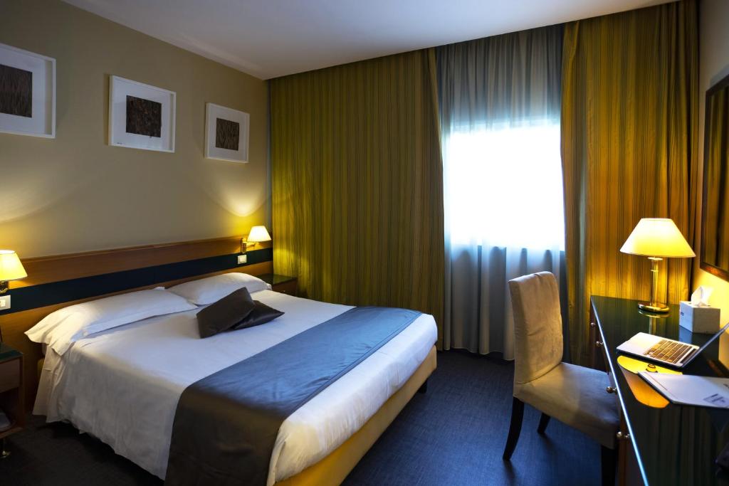 Postel nebo postele na pokoji v ubytování BV Hotel Oly