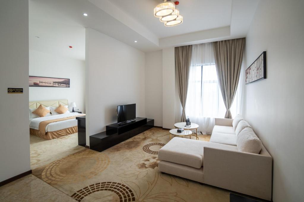 Postel nebo postele na pokoji v ubytování Hotel Sanchaung