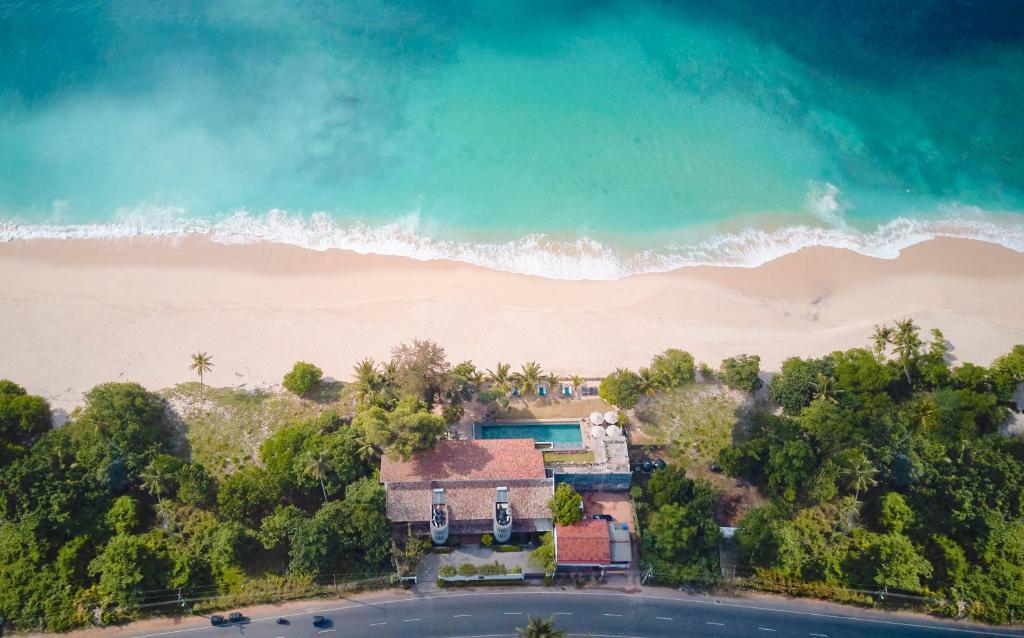 an aerial view of a house next to the beach at Lantern Boutique Hotel by Reveal in Mirissa