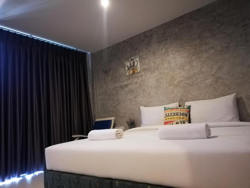 Postel nebo postele na pokoji v ubytování Laemsai Resort