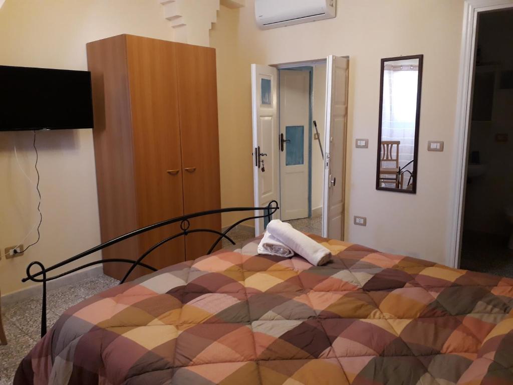 Posteľ alebo postele v izbe v ubytovaní L'Antico Faro