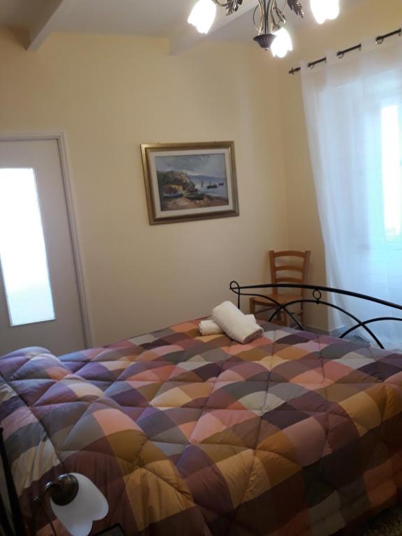 Posteľ alebo postele v izbe v ubytovaní L'Antico Faro