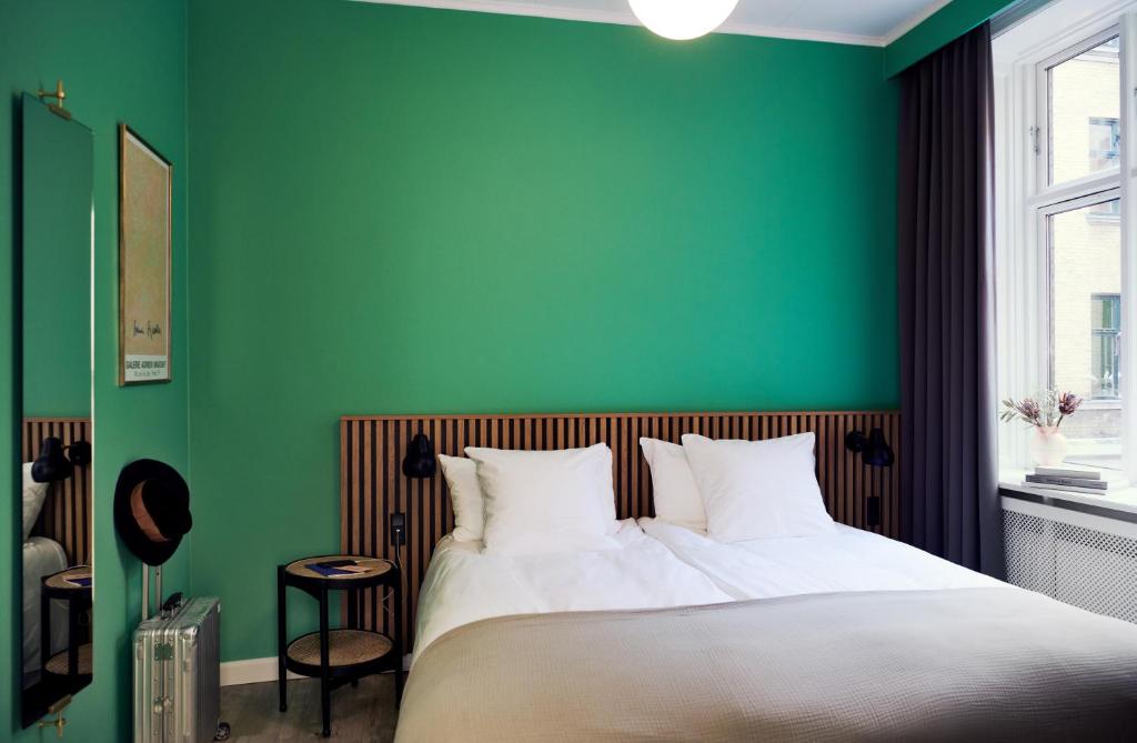 Postel nebo postele na pokoji v ubytování Coco Hotel
