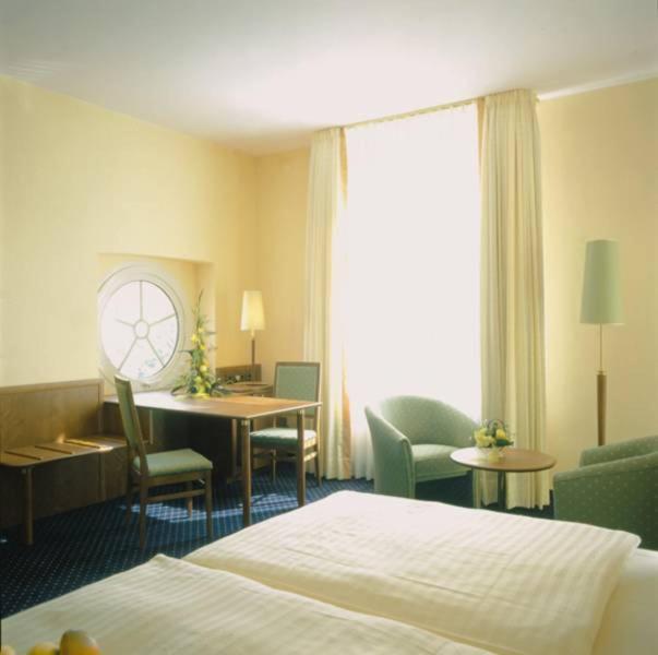 Postel nebo postele na pokoji v ubytování Victoria Hotel