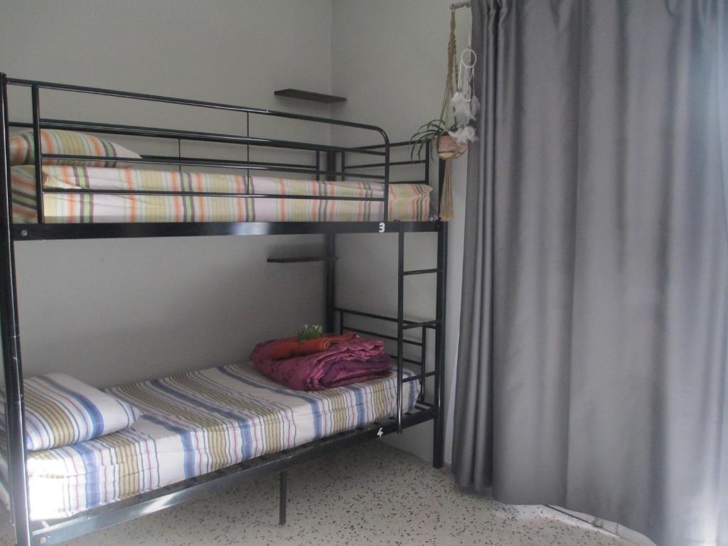Postel nebo postele na pokoji v ubytování Boho Hostel