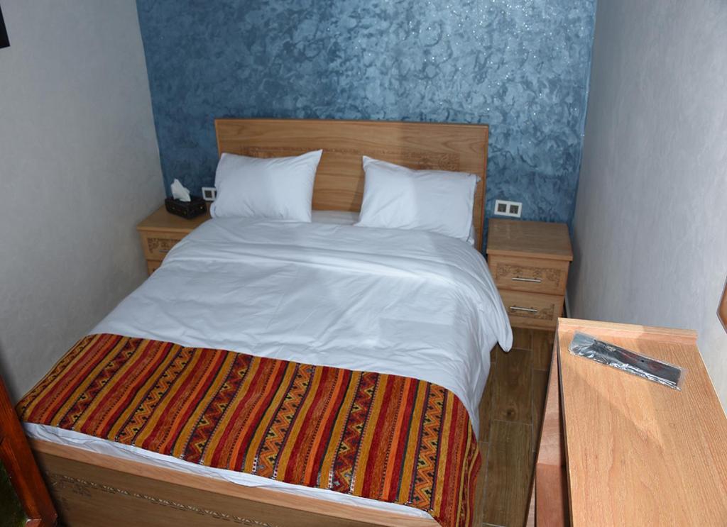 Postel nebo postele na pokoji v ubytování Riad Dar El Mesk