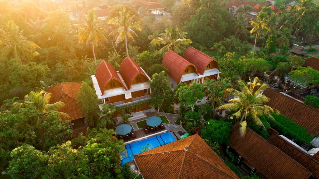 an aerial view of a resort with palm trees at Gunung Merta Bungalows in Ubud