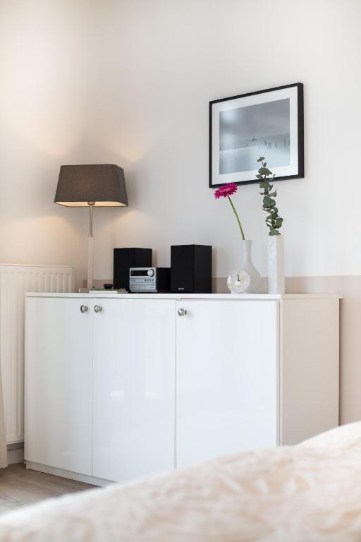 TV a/nebo společenská místnost v ubytování Appartements Villa Schwanenteich