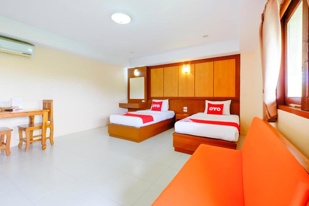 Postel nebo postele na pokoji v ubytování Rak Samui Residence