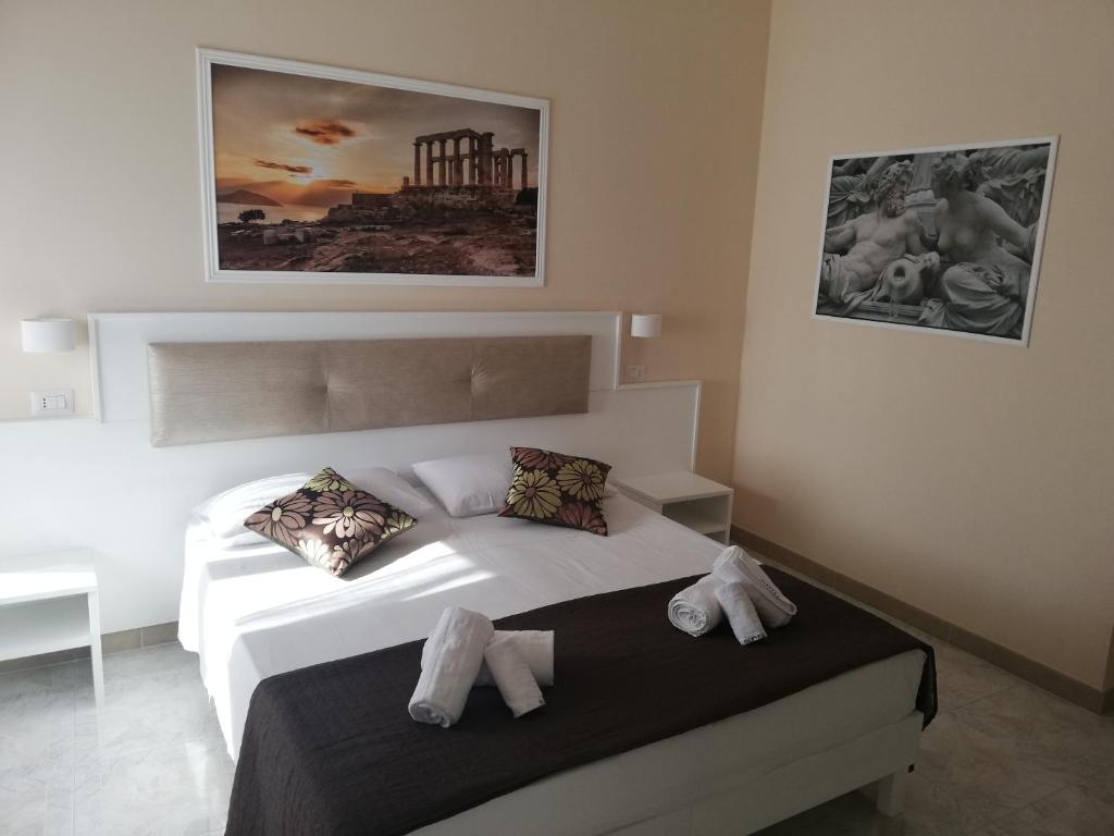 Postel nebo postele na pokoji v ubytování OLYMPUS ROOM