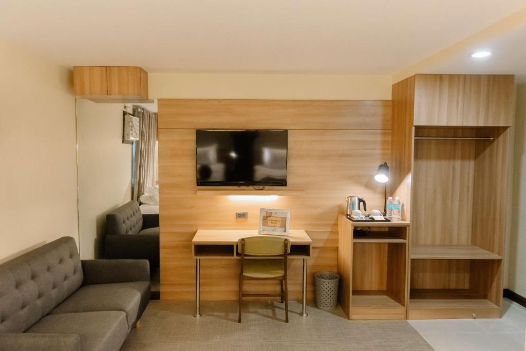 TV a/nebo společenská místnost v ubytování L' Meridian Suites