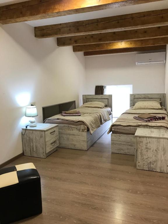 Postel nebo postele na pokoji v ubytování Le Petit