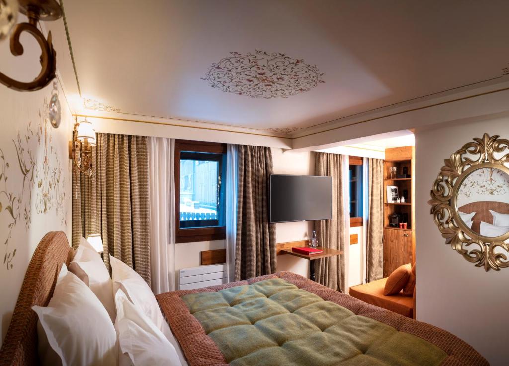 Postel nebo postele na pokoji v ubytování Hôtel de la Loze