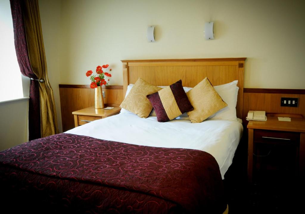 Postel nebo postele na pokoji v ubytování Bush Hotel