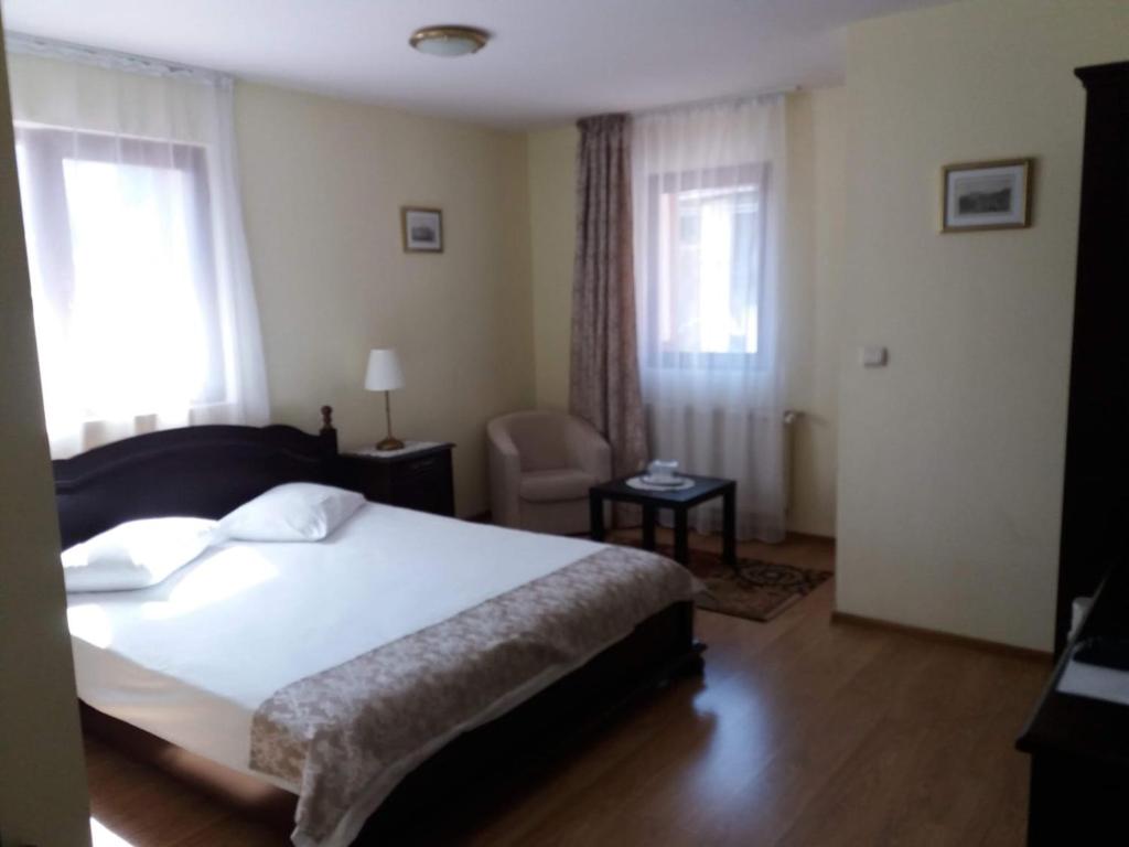 Postel nebo postele na pokoji v ubytování Vila Felix