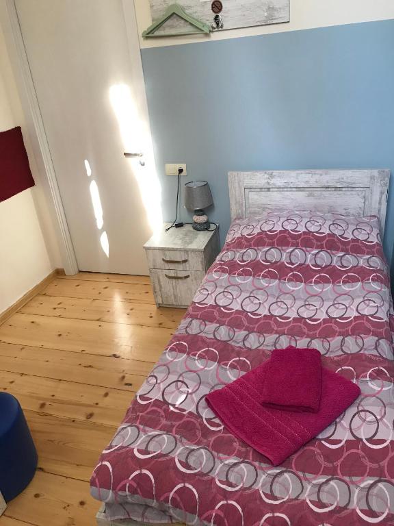 Postel nebo postele na pokoji v ubytování Le Petit