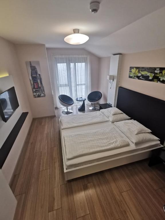 Posteľ alebo postele v izbe v ubytovaní Gokart Hotel