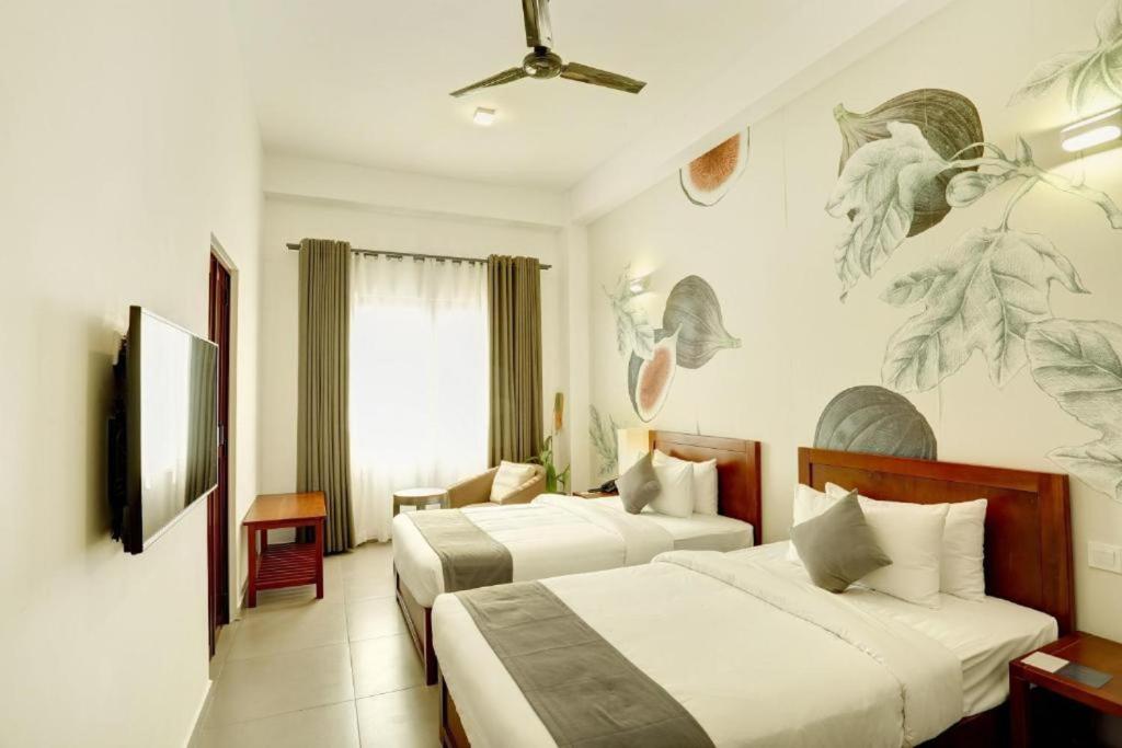 Postel nebo postele na pokoji v ubytování Morven Hotel Colombo