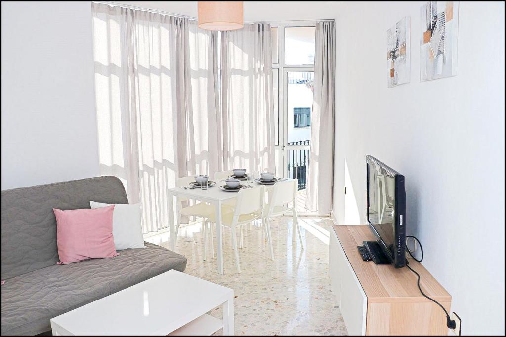 Televízia a/alebo spoločenská miestnosť v ubytovaní Apartamento luminoso en el centro