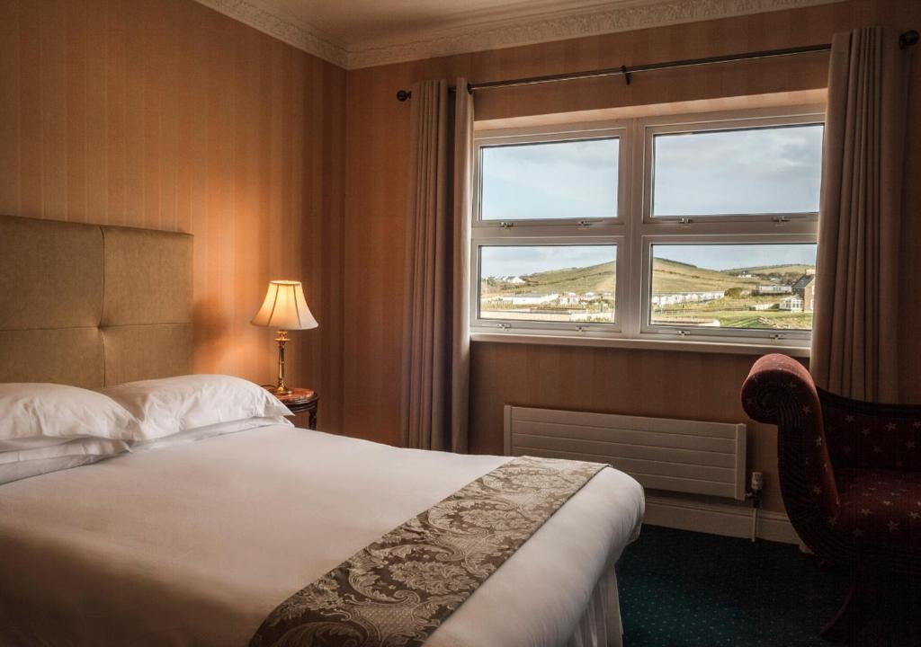 Postel nebo postele na pokoji v ubytování Sandhouse Hotel