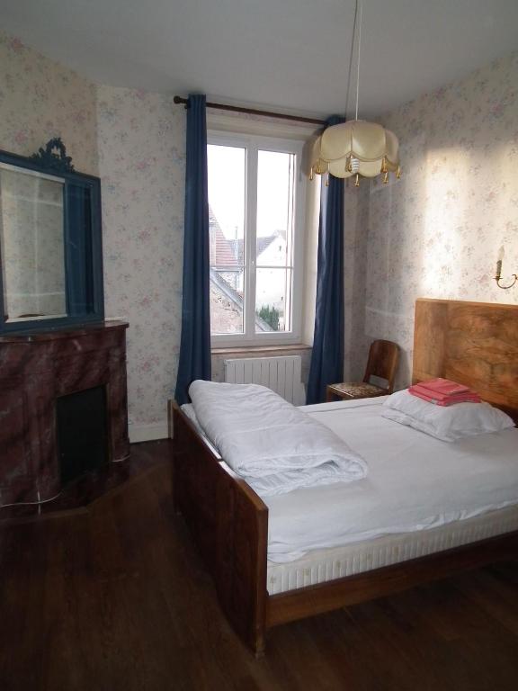 Postel nebo postele na pokoji v ubytování Gite de Chassigny
