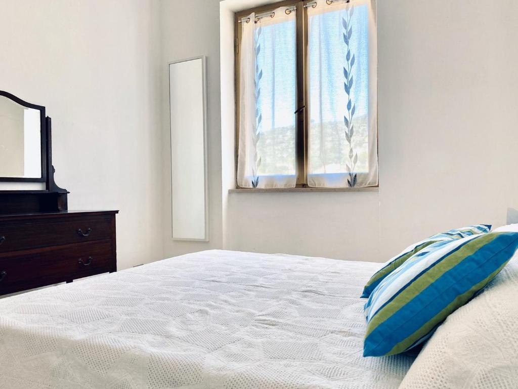 Katil atau katil-katil dalam bilik di Appartamenti vicini al mare a Giglio campese