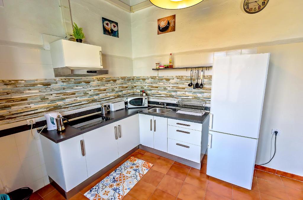 A kitchen or kitchenette at Milagros Central Apartments