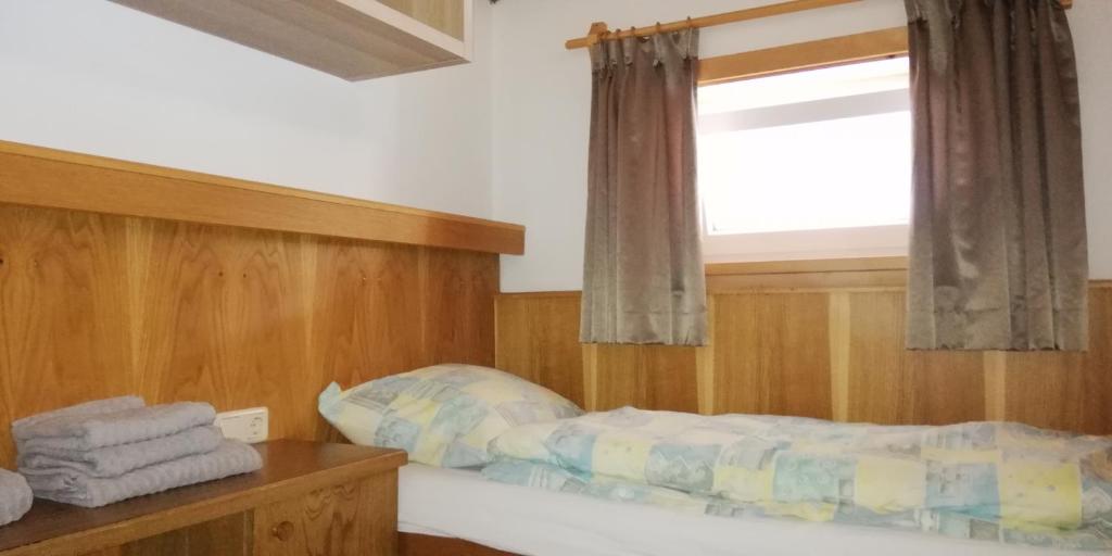 Postel nebo postele na pokoji v ubytování Haus Dienten Top 11