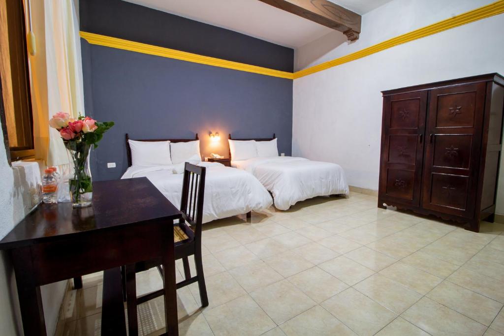 Postel nebo postele na pokoji v ubytování Hotel Montejo