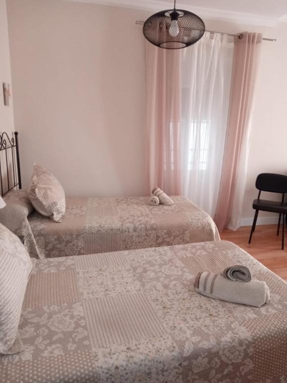 Posteľ alebo postele v izbe v ubytovaní La Casa de Pepa