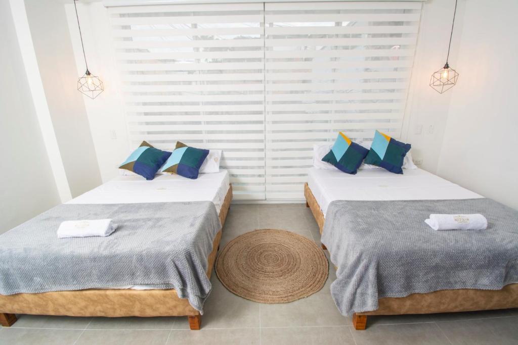 Postel nebo postele na pokoji v ubytování Hotel Viena