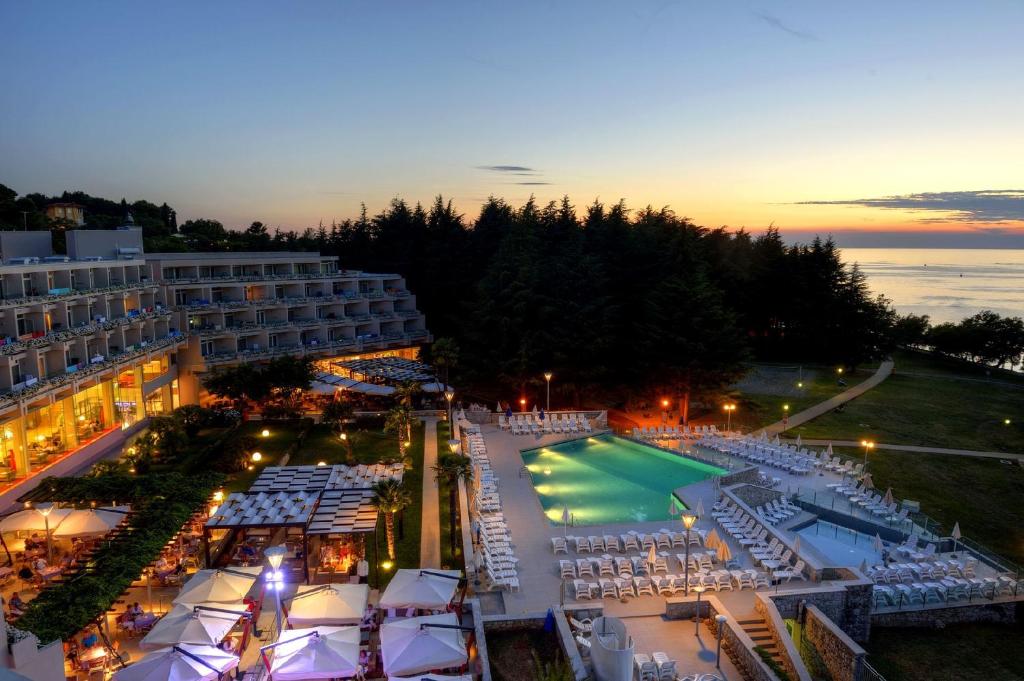 an aerial view of a resort with a tennis court at Hotel Mediteran Plava Laguna in Poreč