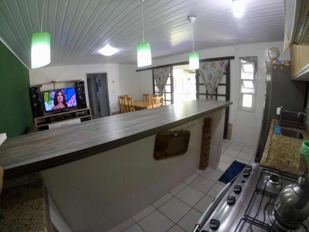  Casa em Torres as margens do rio com linda vista.