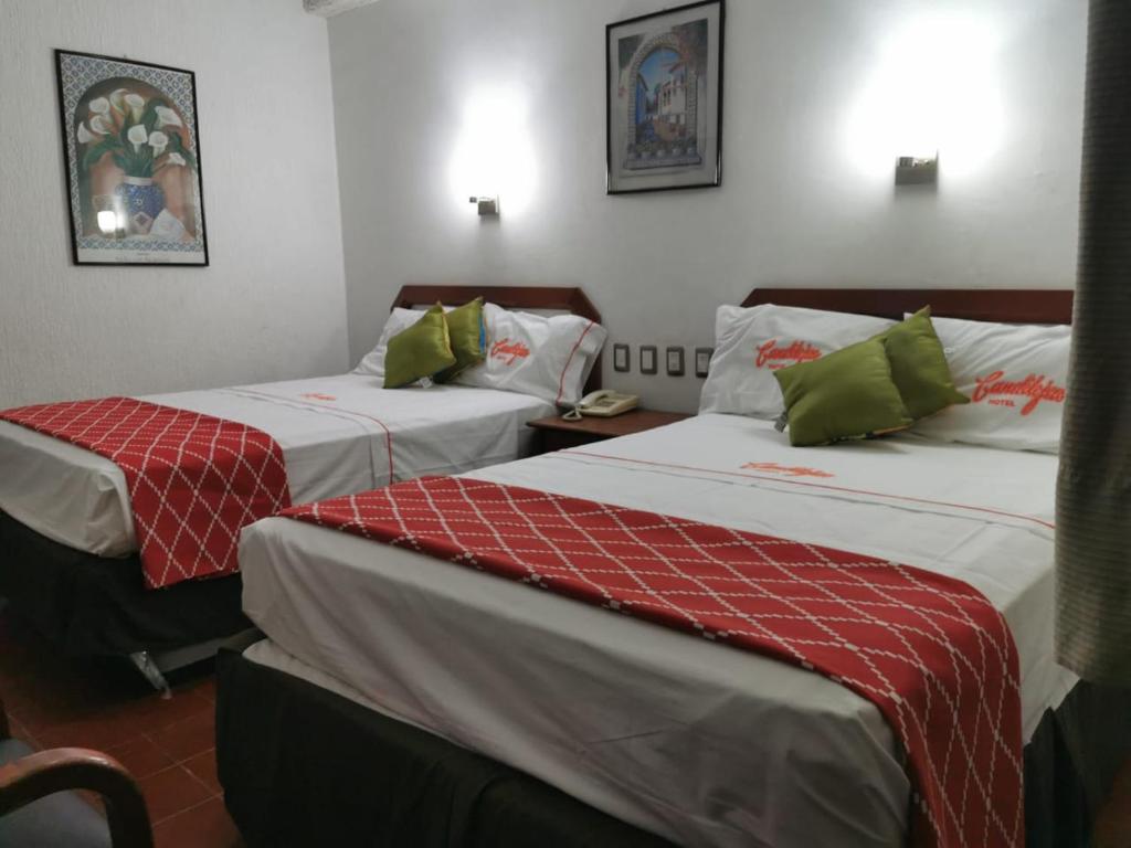 Postel nebo postele na pokoji v ubytování Hotel Candilejas Playa