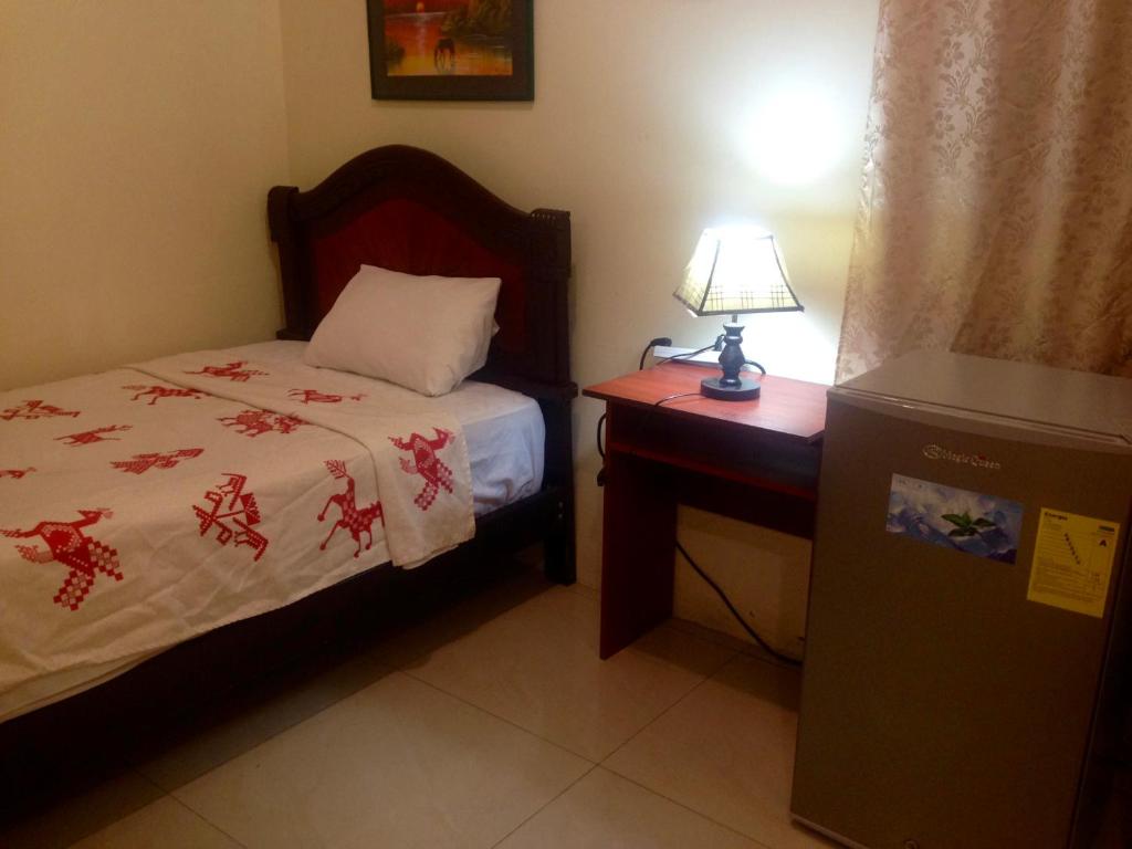 Postel nebo postele na pokoji v ubytování Hotel MundialCity