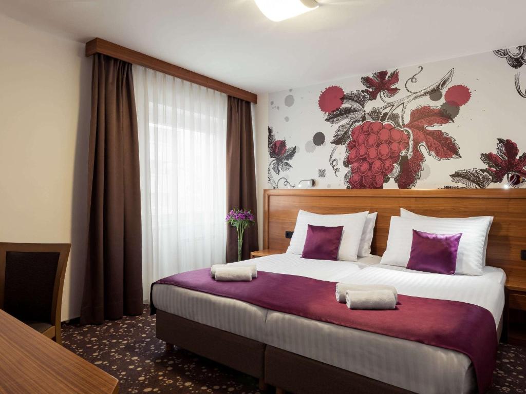 Postel nebo postele na pokoji v ubytování Hotel Piramida
