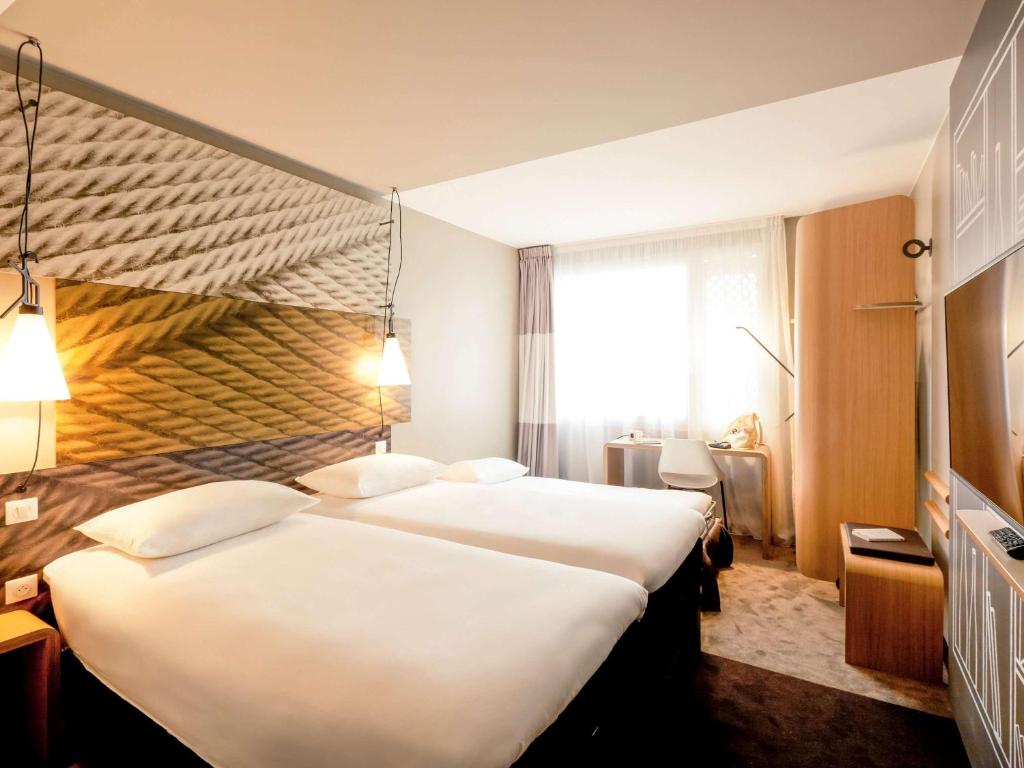 Postel nebo postele na pokoji v ubytování ibis Lyon Carre De Soie