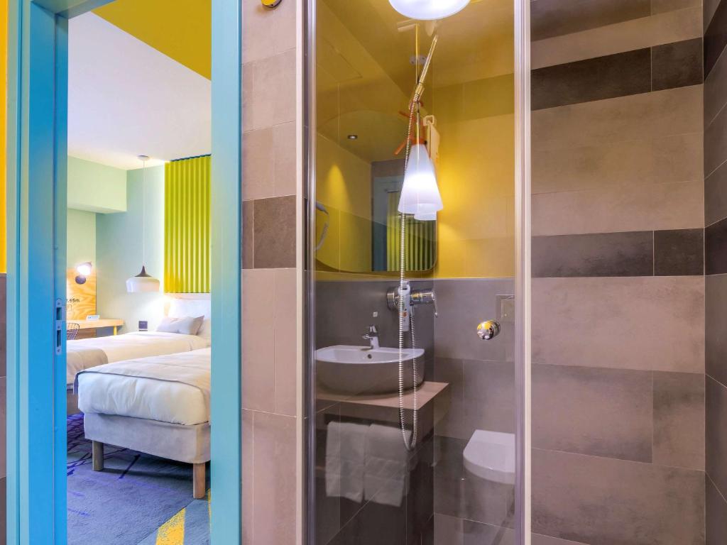 Postel nebo postele na pokoji v ubytování ibis Styles Bucharest Erbas