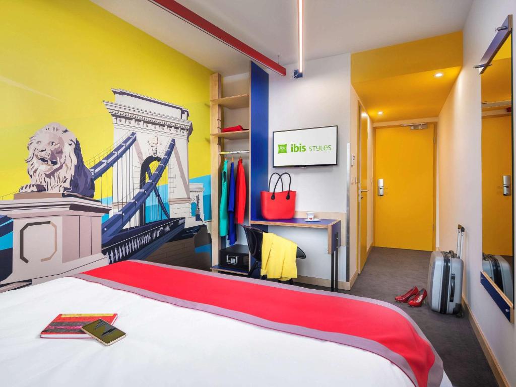 A bed or beds in a room at ibis Styles Budapest Citywest