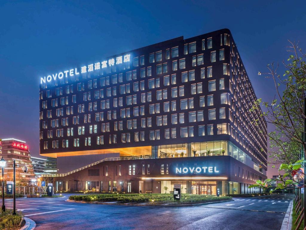 a building with a sign on the side of it at Novotel Shanghai Hongqiao in Shanghai